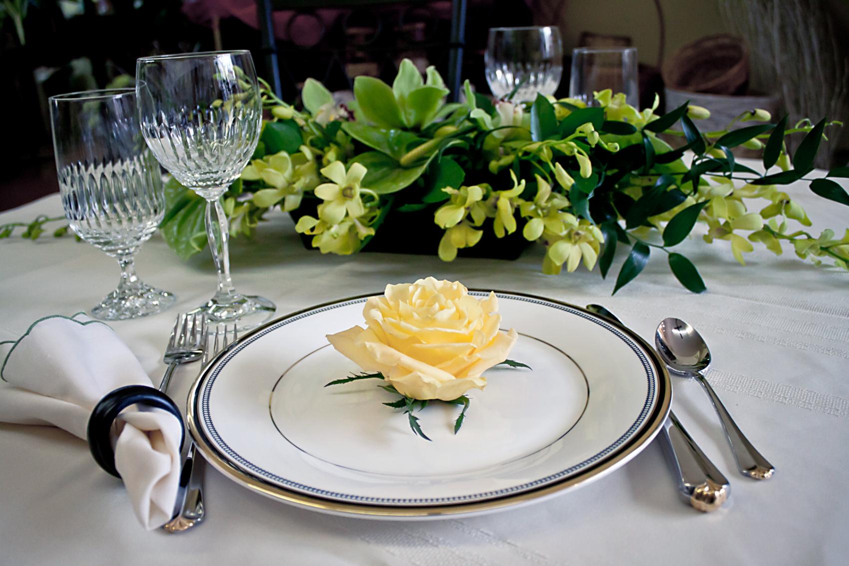 table setting with yellow rose